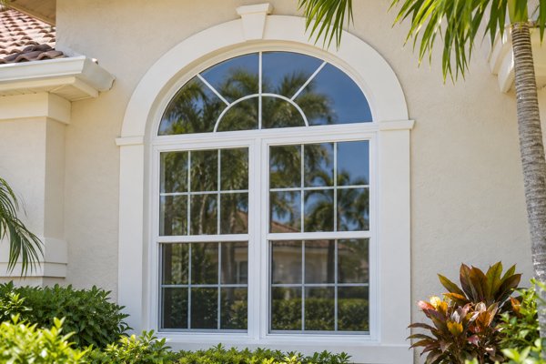 Arched transom and rectangular windows on a Florida-style home
